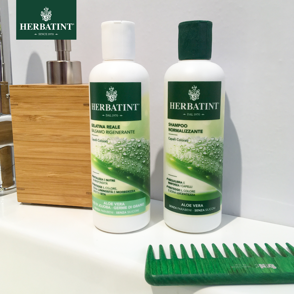 Herbatint Aloe Vera shampoo and conditioner on a bathroom sink. 