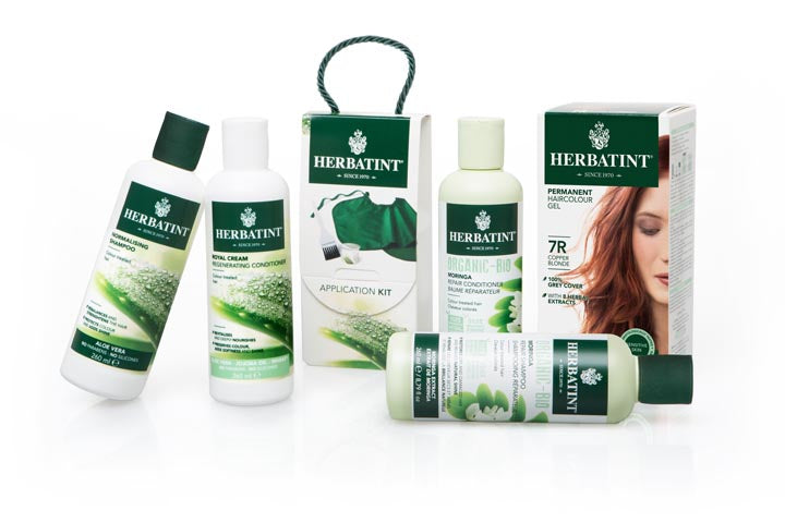 A box of Herbatint hair dye, the application kit, and bottles of shampoo and conditioner. 